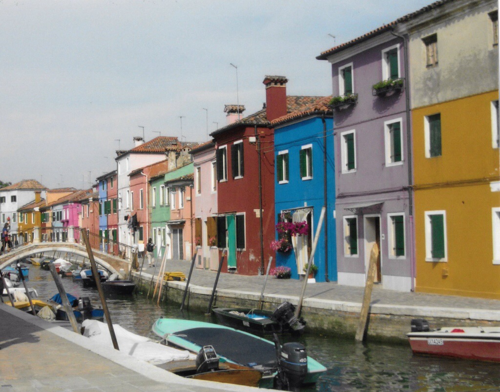 colorful houses and boats in burano, italy, just a quick boat ride away from venice