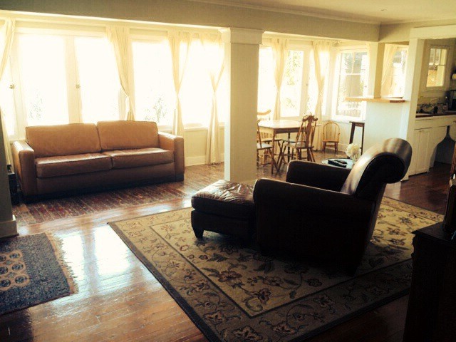 you can't go wrong with the view of the griffith observatory and hollywood sign from the oversized armchair at the cottages of silverlake