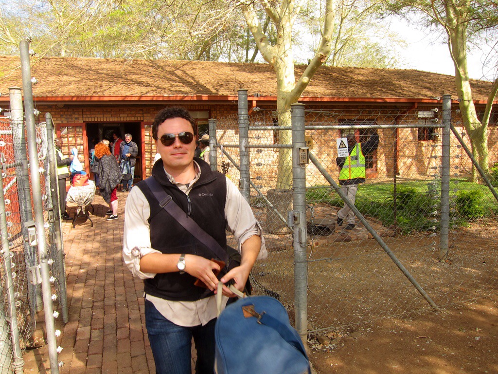 my husband with his carry-on duffle after passing through "security" at the hoedspruit airport.