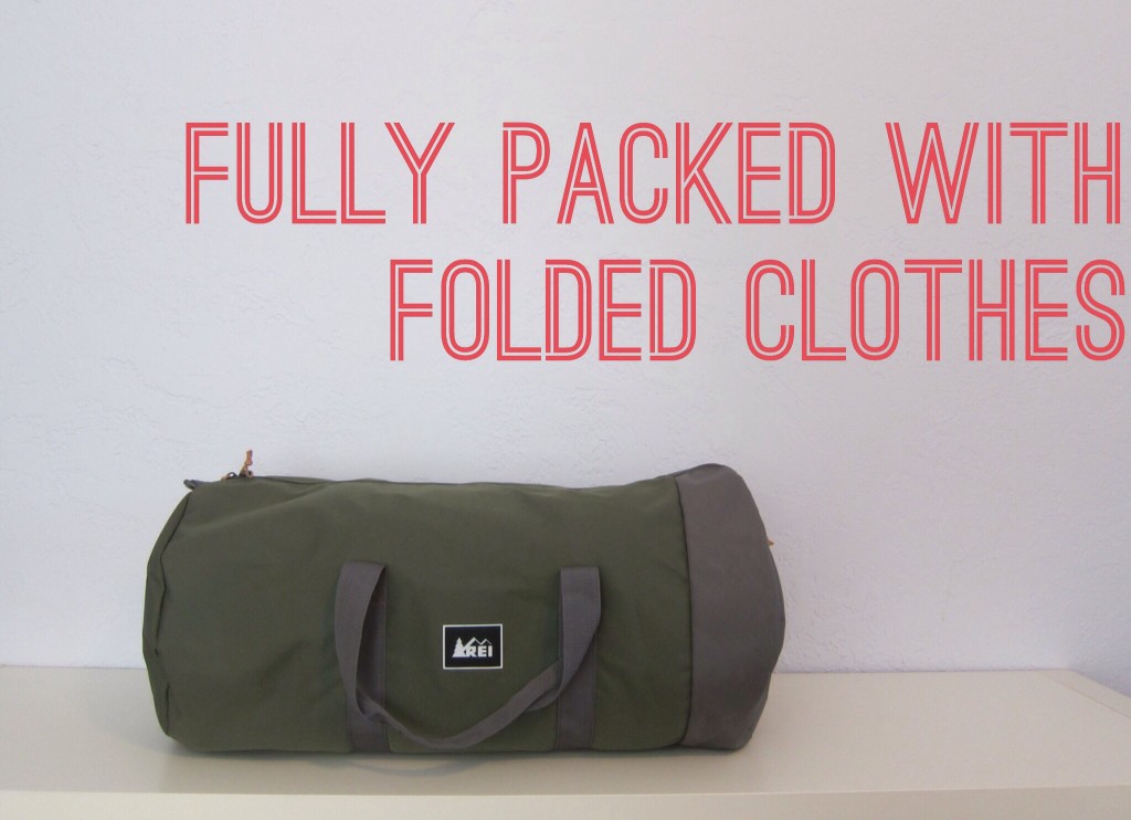 the packed bag with folded clothes