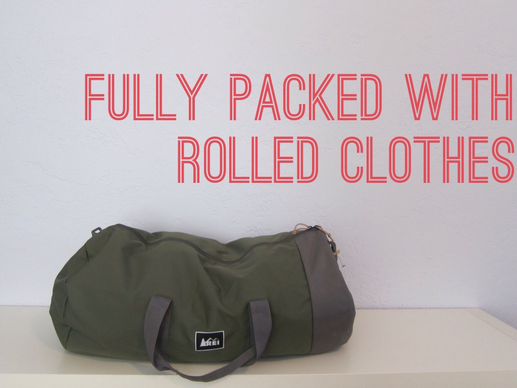 the packed bag with rolled clothes