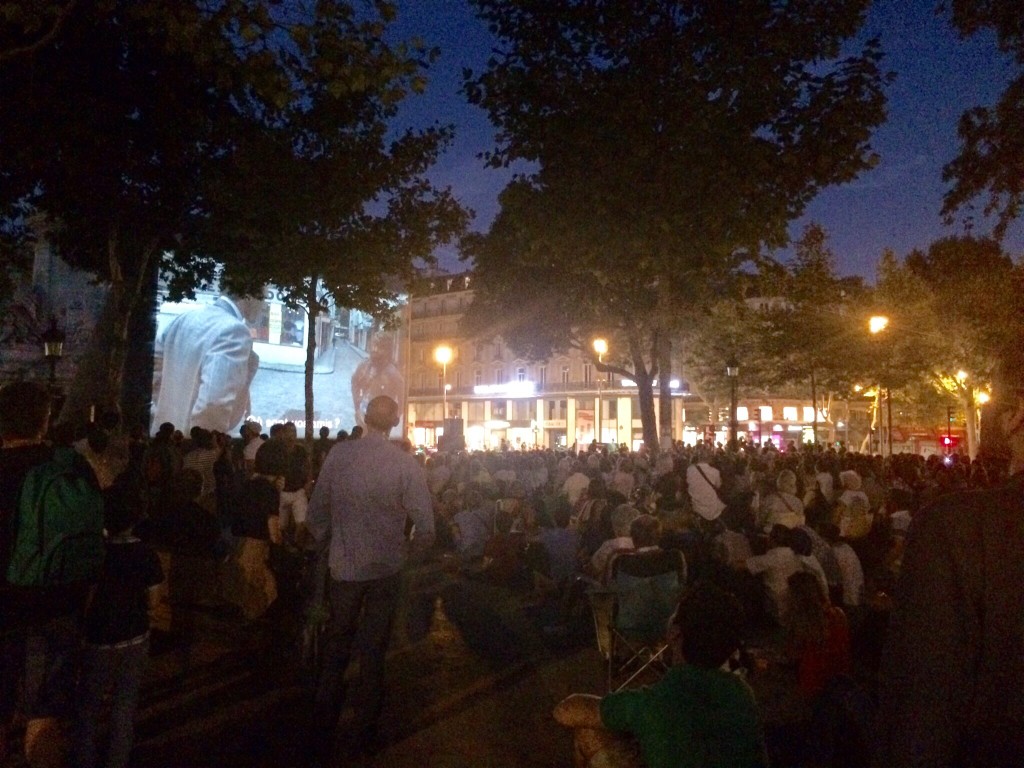 a public movie screening at the place de la république.